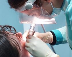 Dentist performing Oral surgery